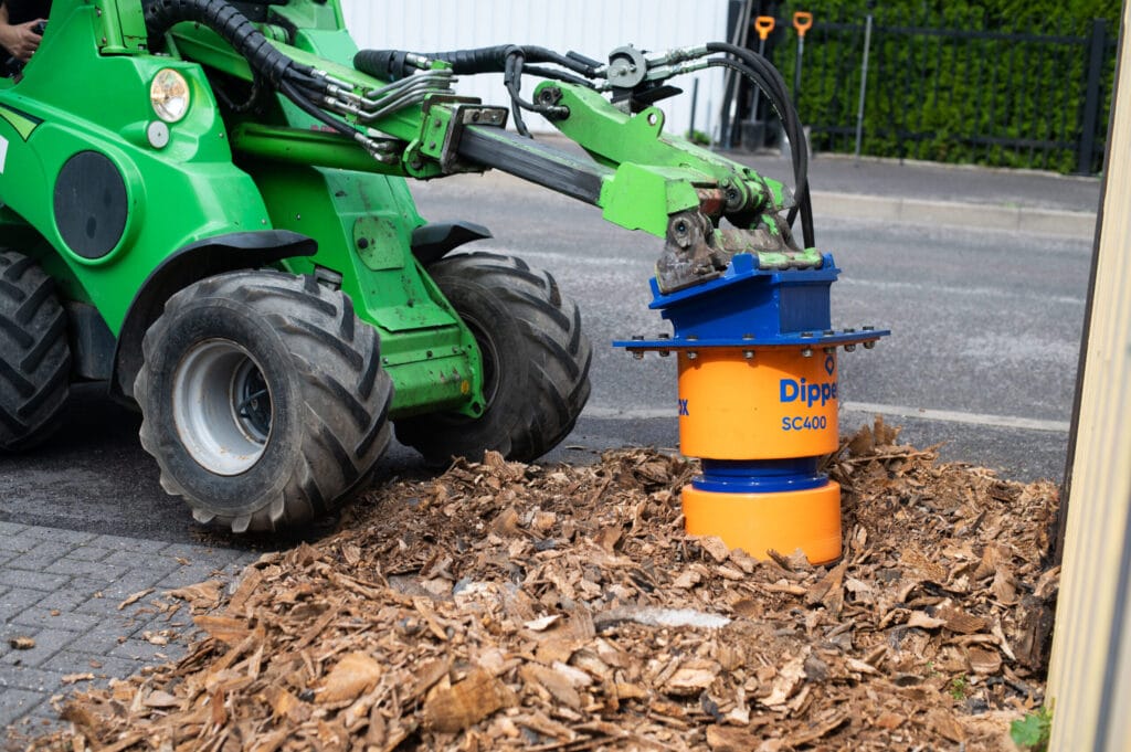 Dipperfox 400 Stump Crusher mounted on compact equipment demonstrating professional stump removal operation