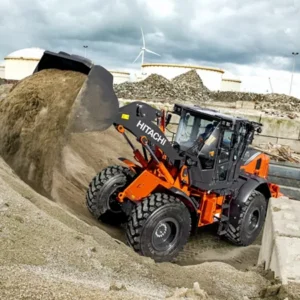 Hitachi-ZW160 scooping up dirt.